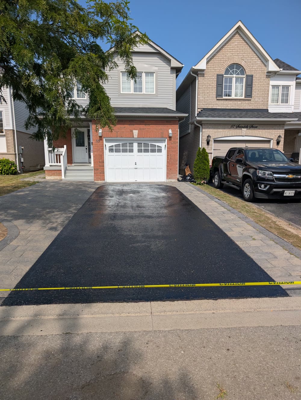 Freshly sealed asphalt driveway in the GTA